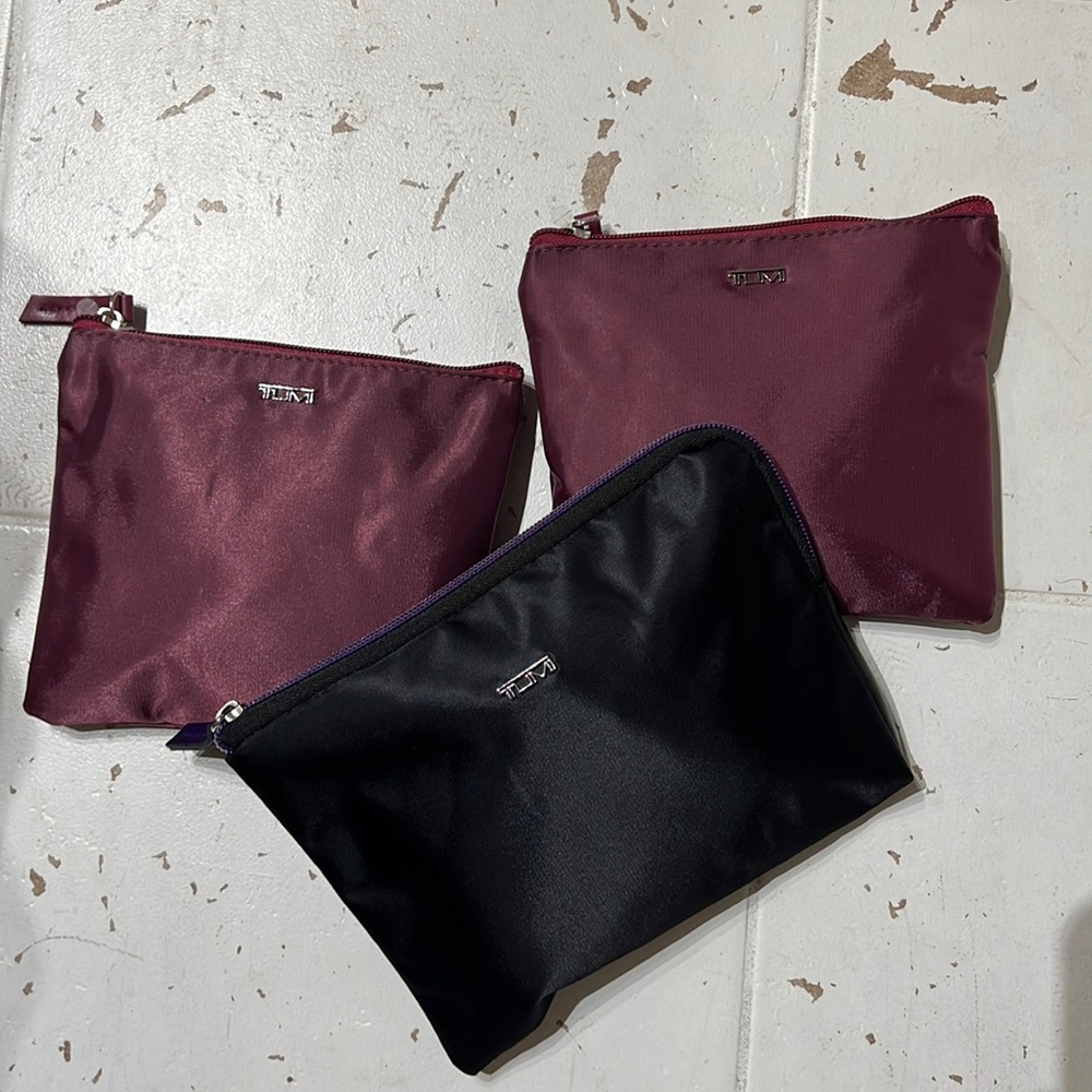 1 Tumi pouch with travel essentials